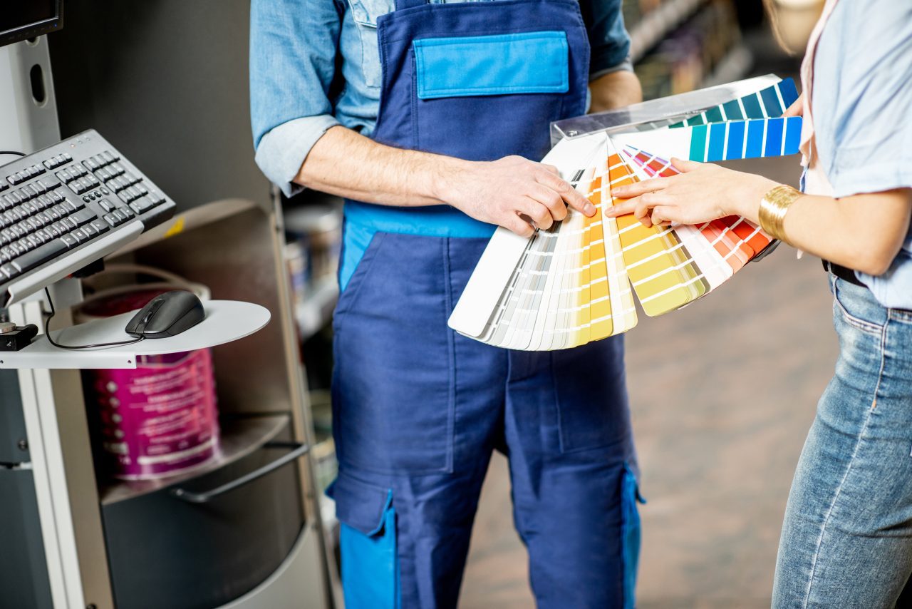 choosing paints in the building shop e1698227438377